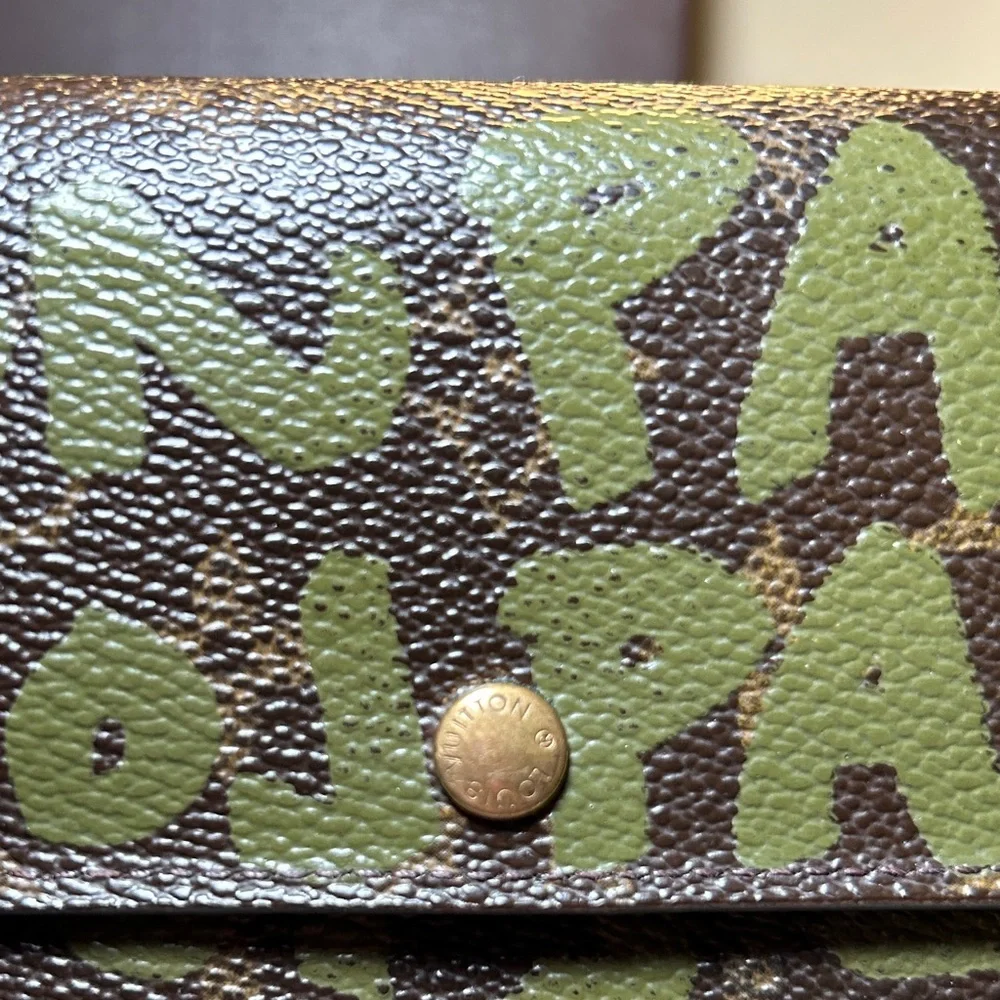 338. Louis Vuitton Limited Edition Monogram Graffiti Sarah Wallet,